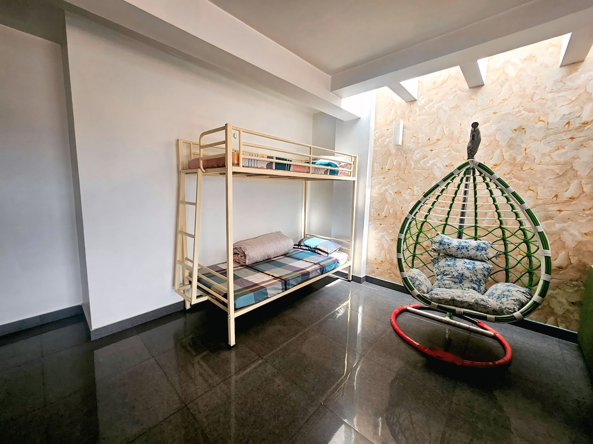 Bunk Bed Room with Hanging Egg Chair & Stone Accent Wall