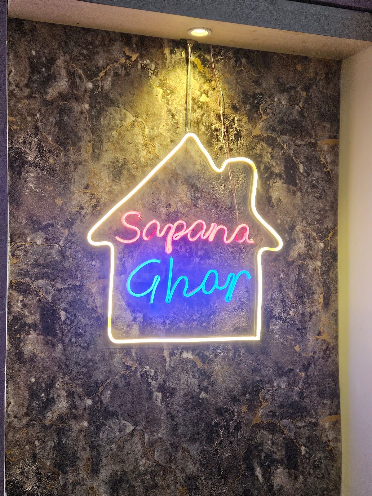 Sapana Ghar Neon Sign on Dark Marble Wall